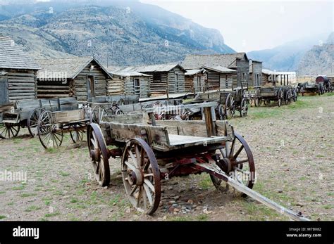 Wagons And Abandoned Houses In A Ghost Town Old Trail Town Cody