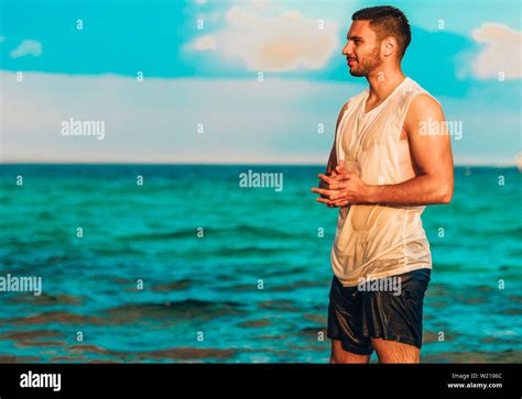 Beach Man Looking At Ocean Enjoying View Standing Handsome Fit Male Fitness Model On Beautiful