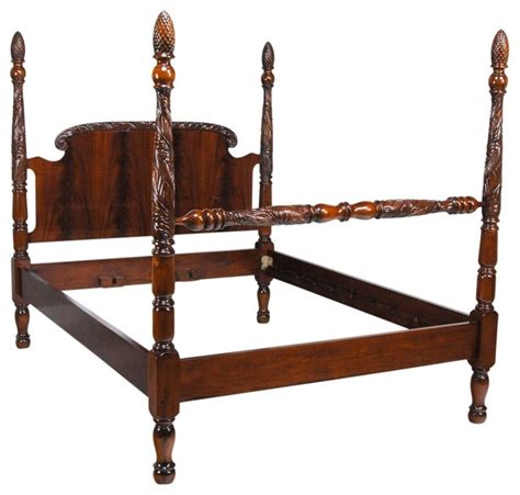 Inspired by victorian decadence, this elaborately carved four post canopy bed will make a stunning centerpiece to your traditional master bedroom. Mahogany Pineapple Poster Bed, King - Victorian - Canopy ...