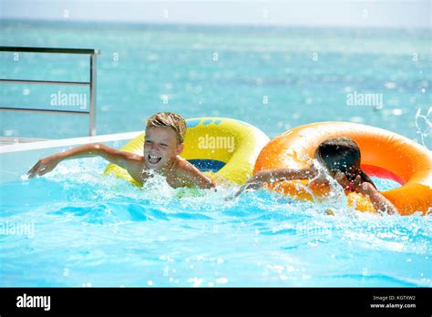 Kids Having Fun In Swimming Pool Stock Photo Alamy