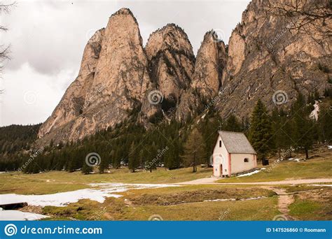 Beautiful Mountain Scenery In The Alps With Fresh Green Meadows In