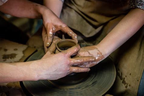 Pottery Classes Student Making Clay Pot On Wheel Close Up Of Dirty