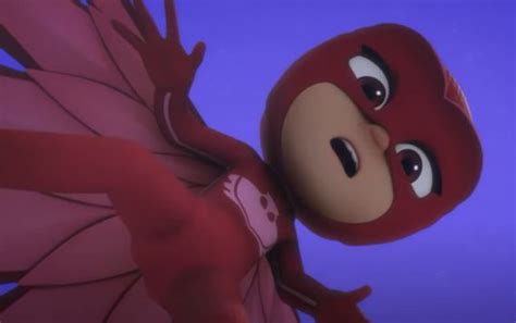 A Close Up Of A Cartoon Character Wearing A Red Mask And Wings With