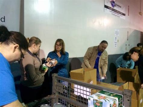 Volunteers help us by boxing. ASM Helps the Mid South Food Bank | ASM Blog