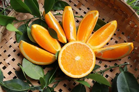 Orange Fruit Fruits Or Vegetables Half And Slice With Green Leaves