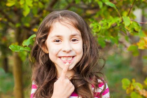 portrait of girl pointing with finger her new adult tooth stock image image of permanent