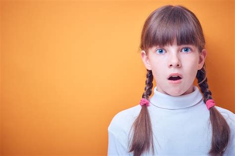 Premium Photo Scared And Surprised Caucasian Teen Girl On Colored