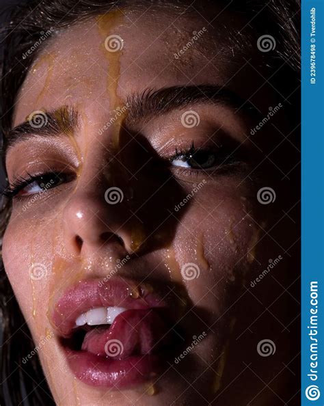 Sensual Young Woman Face With Honey Drop Close Up Beautiful Girl