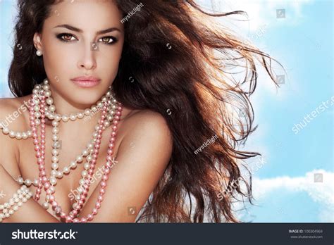 Beautiful Long Hair Brunette Woman With Pearls Necklace Summer Day