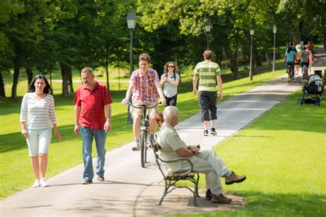 People Walking In Park Stock Photo Download Image Now Public Park