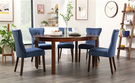 ( 4.3) out of 5 stars. Marlborough Round Dark Wood Extending Dining Table with 6 Bewley Blue Velvet Chairs in 2020 ...