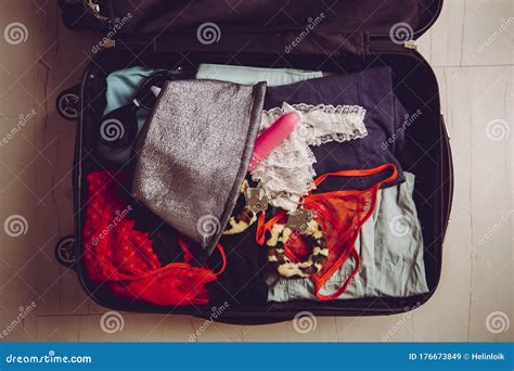 Traveling With Sex Toys Concept Packing Sex Toys In Luggage Suitcase When Going On Trip Stock