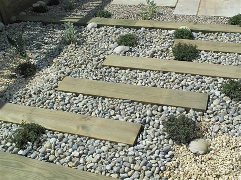 We design and manage the build from start to finish, no miscommunication. sleeper gravel path | Garden ideas | Pinterest
