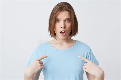 Amazed Shocked Young Woman In Blue T Shirt With Opened Mouth Looks