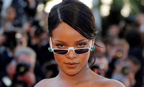 Rihanna Goes Topless To Promote Lingerie Brand Photos