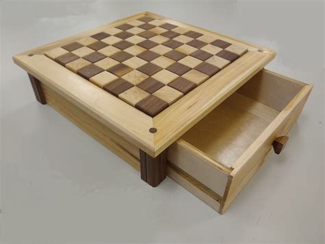 Whether looking for competition or an exercise session for the brain, this beautiful chess table will keep your knights and bishops on an even playing field. Woodworking Plans Chess Board with drawer Paper plans ...