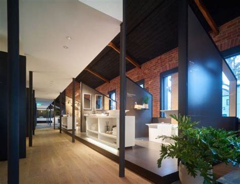 The Interior Of A Modern House With Wood Floors And Brick Walls Along
