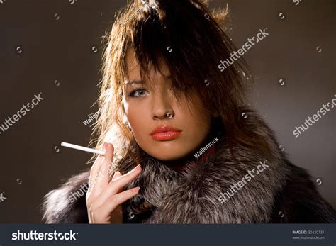 Portrait Of Beautiful Woman Smoking Cigarette Stock Photo