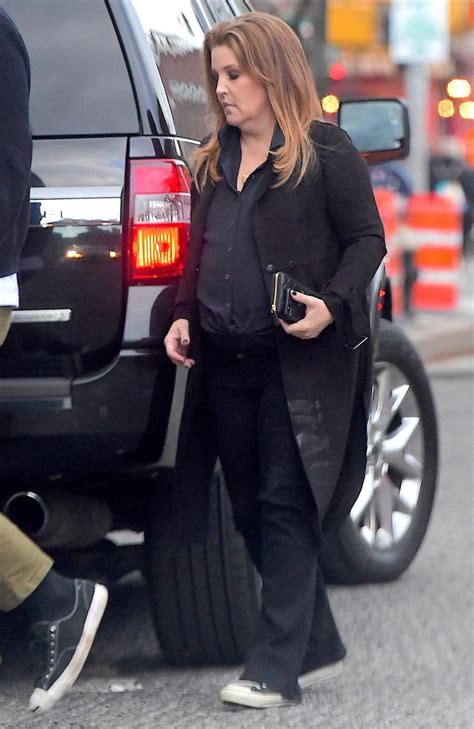 She likes to color coloring books. Lisa Marie Presley spotted in rare public outing