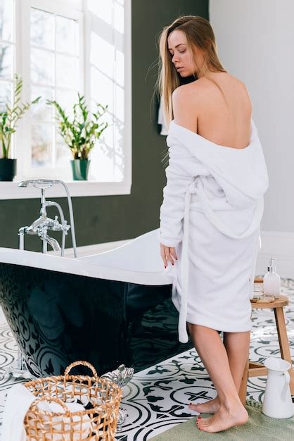 Free Photo Blonde Girl Posing In The Bathroom With Bath Robe