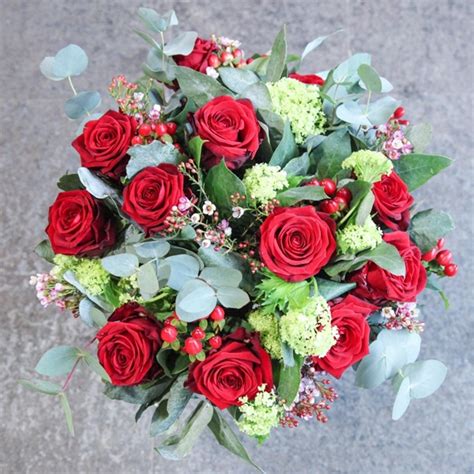 Burgeon Floral Design 12 Red Roses With Berries And Foliage