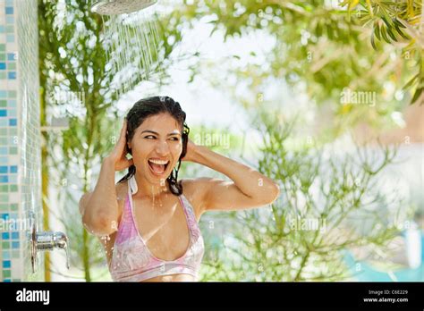 Hispanic Woman Showering Outdoors Stock Photo Alamy