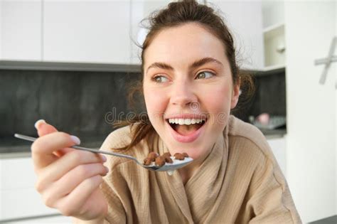 Close Up Portrait Of Happy Smiling Brunette In Bathrobe Holding