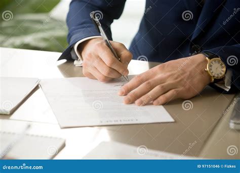 Male Hand Putting Signature On Contract Signing Document Close Stock