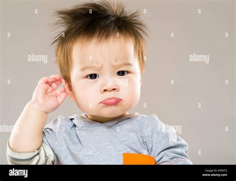 Confused Baby Boy Hand Touch Ear Stock Photo 168613987 Alamy
