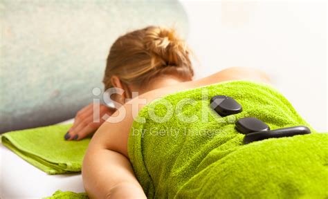 Spa Salon Woman Relaxing Having Hot Stone Massage Bodycare Stock