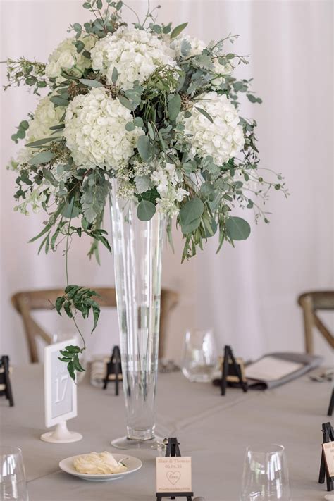 Pilsner Vase With White Hydrangea Eucalyptus Dusty Miller Flower Centerpieces Wedding