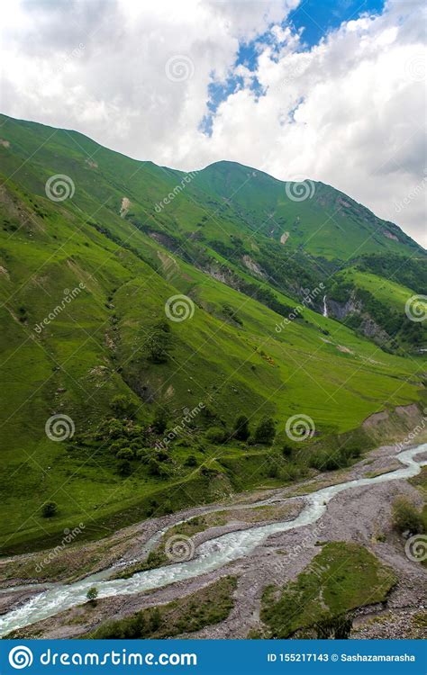 Beautiful Mountains Landscape With River In Grass Valley