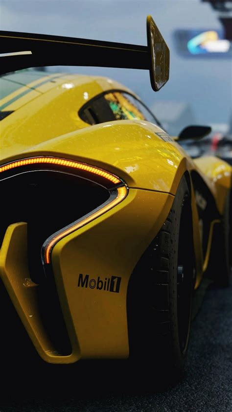 Download McLaren iPhone P1 GTR Yellow Wallpaper | Wallpapers.com