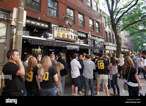Boston Bruins Hockey Fans Line Up To Enter A Bar In Boston For Game
