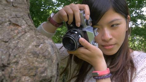 Beautiful Asian Amateur Photographer Taking Photos Of A Tree 4k Video