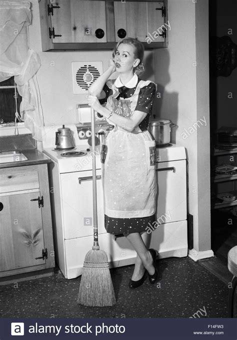 Download This Stock Image 1950s Tired Housewife In Apron Standing In