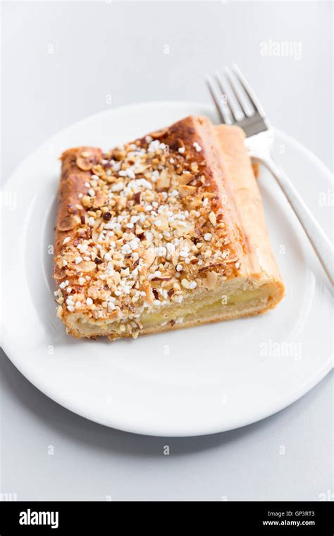 Danish Pastry On White Plate With Fork Traditional Sweet Cake With