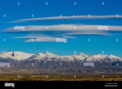 Usa Nevada Ruby Mountains Snow Capped And Lenticular Clouds Stock