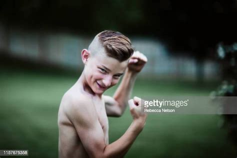 Teen Boy Showing Biceps Photos Et Images De Collection Getty Images