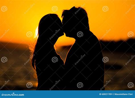 Young Couple Kissing On The Beach Sunset Stock Image Image Of Females