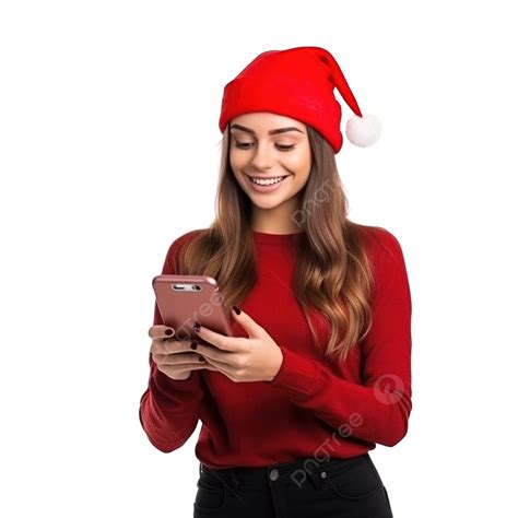 فتاة شابة جميلة ترتدي قبعة سانتا حمراء تحمل هاتفًا بين يديه محتوى خصم عيد الميلاد هاتف شخص