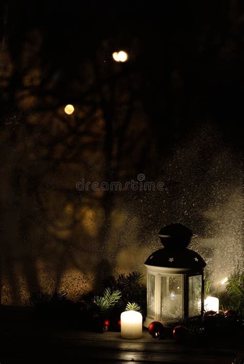 Christmas Lantern With Snowfall Candles View From The Window On The