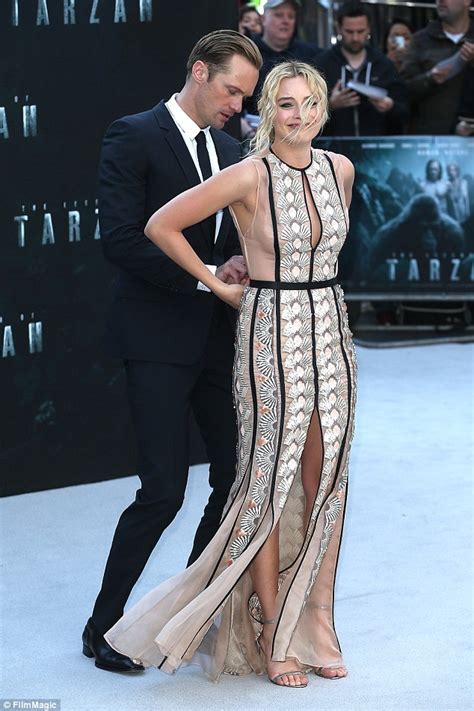 Alexander Skarsgard Helps Margot Robbie With Her Dress At Legend Of