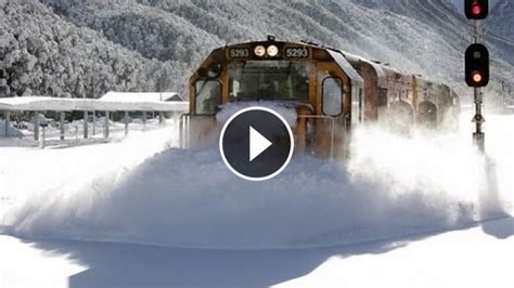 incredible footage of a speeding train plowing through heavy snow on the tracks like its nothing