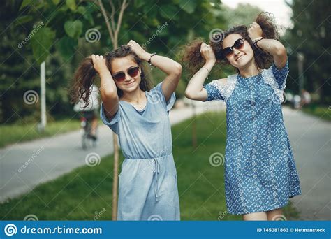 Two Cute Sisters In A Summer Park Stock Image Image Of Blue Attractive 145081863