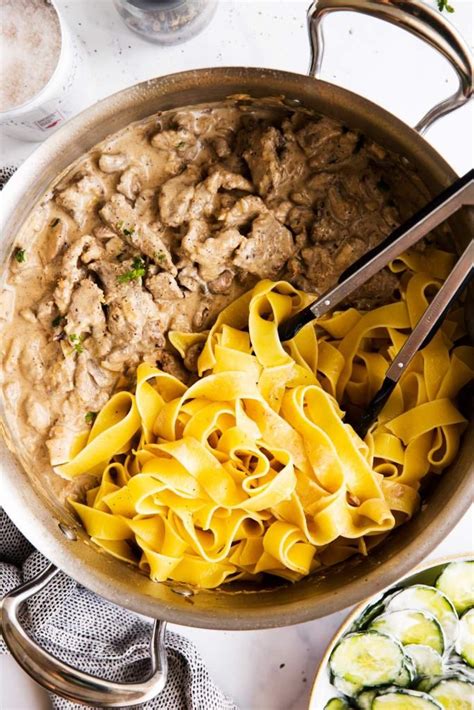 This beef stroganoff is cooked in a slow cooker and served over zucchini noodles with onions and mushrooms in a mouthwatering gravy. Easy Beef Stroganoff Recipe | Savory Nothings in 2020 ...