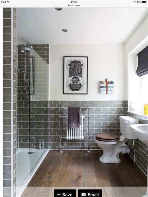 A traditional looking grey patterned feature floor tile designed with a subtle. Grey metro tiles with wood | Bathroom inspiration ...