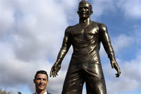 The statue of cristiano ronaldo in front of the entry to the museum cr 7 in funchal on madeira, portugal. Cristiano Ronaldo statue: Real Madrid star gets weirdly ...