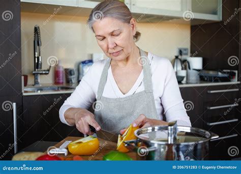 Mature Woman In Kitchen Preparing Food Stock Image Image Of Indoors