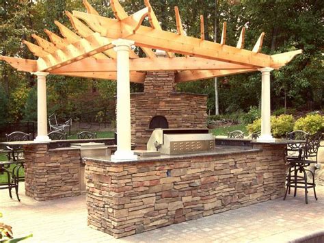 Outdoor kitchens continue to gain in popularity as homeowners across the county seek to spend more time outdoors. Unique Roof Built Rustic Outdoor Kitchen Designs | Rustic outdoor kitchens, Outdoor kitchen bars ...
